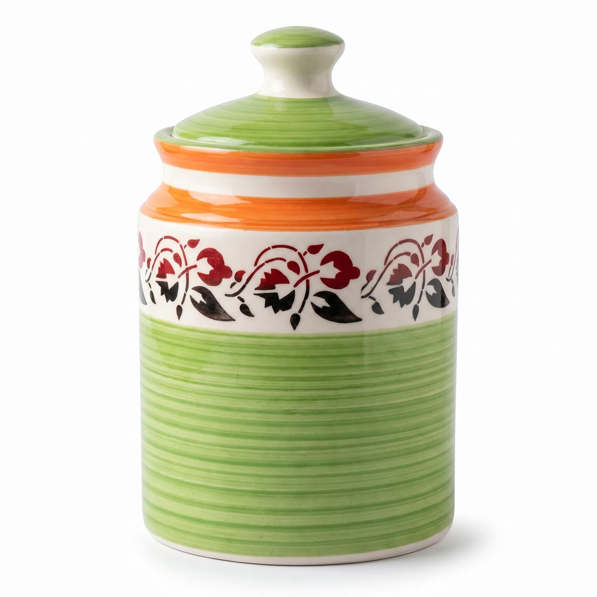 Front view of the orange and green ceramic storage jar with a floral band on a clean white background.