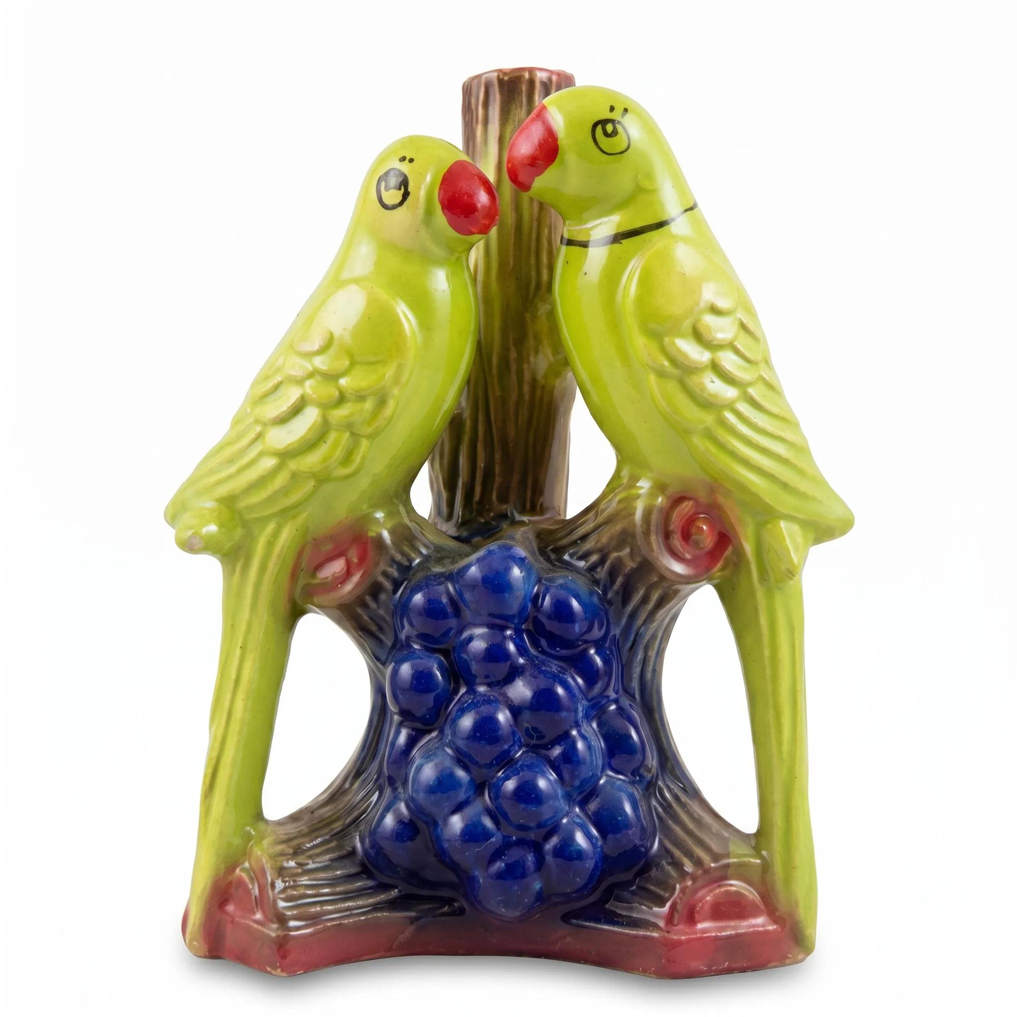 Front view of the green ceramic parrot pair showpiece on a plain white background.